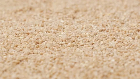 Spelled groats, side view. Raw groats - background. Stock Footage 144925896