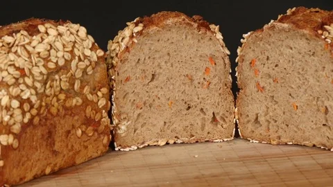 Spelt bread with carrots on turntable Stock Footage 83911918