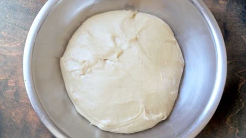 Spelt bread dough goes up 10sec - Timelapse Stock Footage 79709592