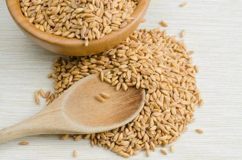 Spelt with spoon, close up Stock Photos