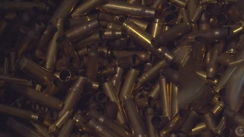 Pile of spent bullet casings. Stock Photo