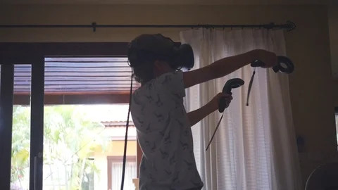 Spend the summer at home playing with virtual glasses and joysticks. slow motion Stock Footage 88799521