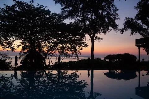 Spend the sunset by the pool Stock Photos