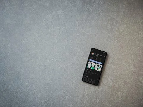 Spendee app play store page on smartphone on ceramic stone background Stock Photos