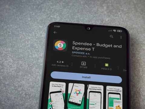 Spendee app play store page on smartphone on ceramic stone background Stock Photos