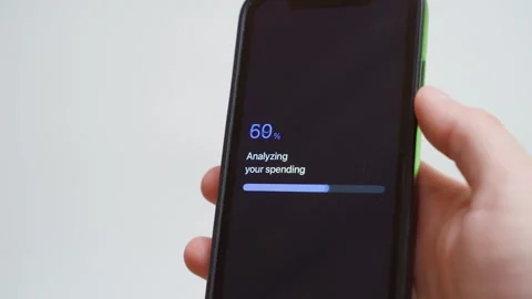 Spending analysis progress on smartphone screen. Report ready confirmation Stock Footage 343238198