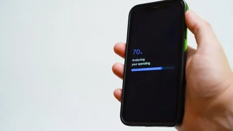 Spending analysis stuck at seventy percent on smartphone screen. Frozen progress Stock-Footage 342735497
