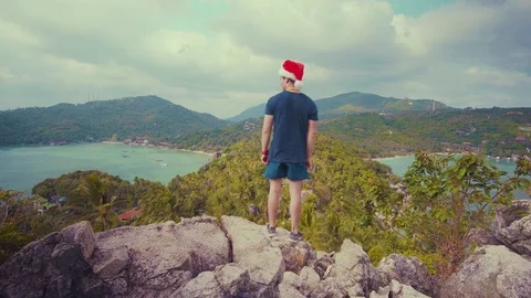 Spending Christmas on a Peak of an Island - Standing (GRADED) Stock Footage