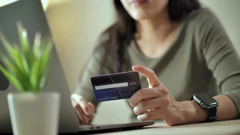 Spending money on internet security numbers and registration or debit Stock Footage 265930991