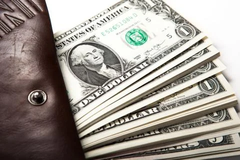 Spending money in your wallet 库存照片