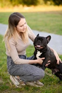 Spending Priceless Quality Time with Pet Dog Outdoors, Happy Young Woman with 스톡 사진