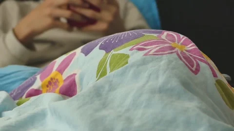 Spending time with cell phone in bed, Stock Footage 166401036
