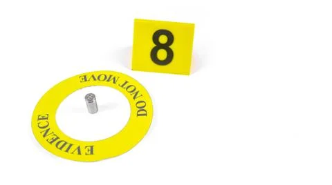 A spent bullet casing placed within a yellow circle, labeled with the text .. Stock Photos