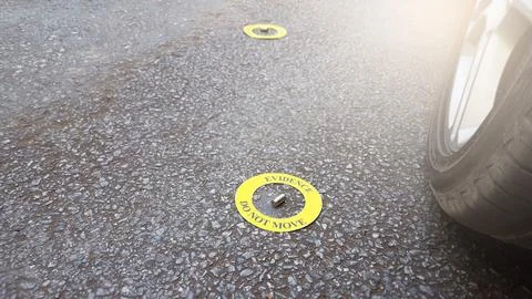 A spent bullet casing placed within a yellow circle, labeled with the text .. Stock Photos