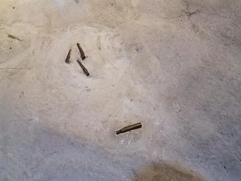 Spent bullets on the ground Stock Photos