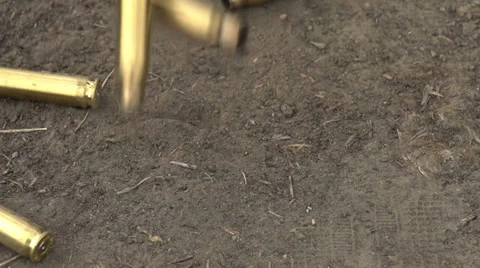 Spent Shells Fall to the Ground Stock Footage 39552462