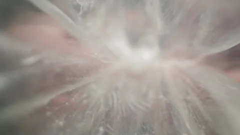 Sperm inside a condom, first-person view, woman removes it, close-up Safe sex Stock Footage 301019501