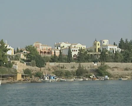 The Spetses shoreline seen from a boat out at sea Stock Footage