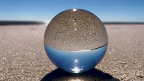 Sphere Lens on beach. 4K. Sound included. Stock Footage 220034892