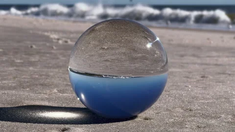 Sphere Lens on beach. 4K. Sound included. Stock Footage 220034906