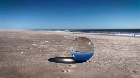 Sphere Lens on beach. 4K. Sound included. Stock Footage 220034908