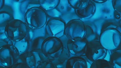 Spheres sinking to the ground underwater Stock Footage 165033395