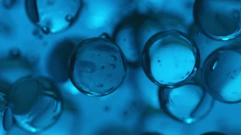 Spheres sinking under water Stock Footage 165033384