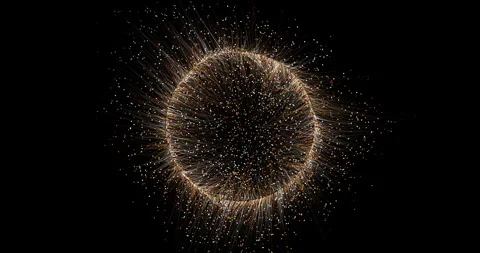 A spherical cluster of shimmering particles is constantly bubbling, emitting thi Stock Footage 333867247
