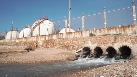 Spherical gas storage tanks in the refinery industry are on the shore with go Stock Footage 108962057