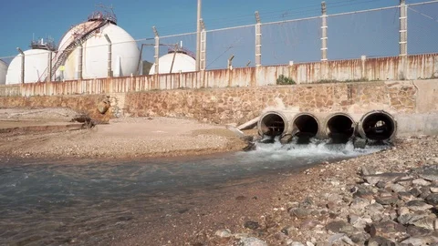 Spherical gas storage tanks in the refinery industry are on the shore with go Stock Footage 108962155