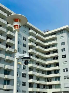 Spherical public security camera in a residential neighborshood. Stock Photos