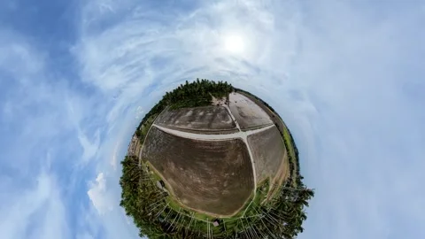 Spherical view captures vast, open farmland under bright sky Видео 345393426