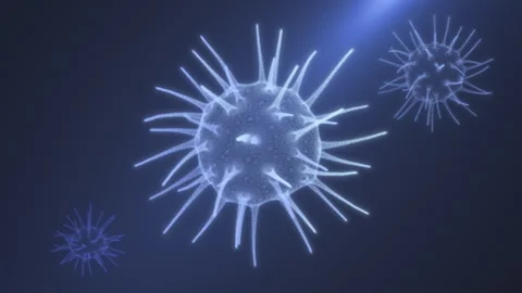 Spherical viruses with a jelly-like body in the rays of light on a blue back Stock Footage 251158317