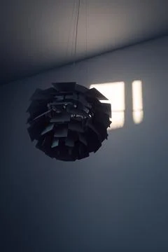 Spherical volume lamp gate of numerous metal petals Stock Photos
