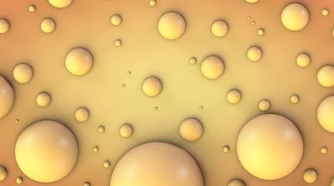 Spherical yellow particles of different diameters on an orange surface Foto stock