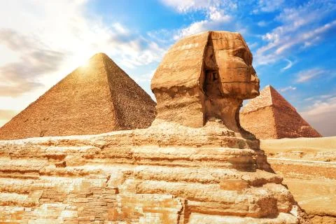 The Sphinx in front of the Pyramids, close view Stock Photos