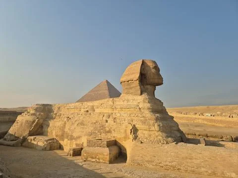 Sphinx statue at Giza pyramid complex in golden hour light Stock Photos