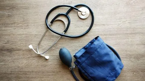 Sphygmomanometer and stethoscope on a surface Stock Photos