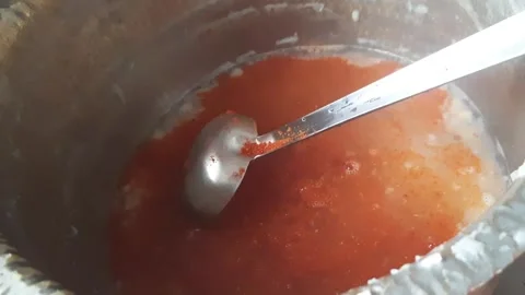 Spice Mixing Process – Red Chili Masala Added to Hot Water for Indian Snack Stock Footage 333045148
