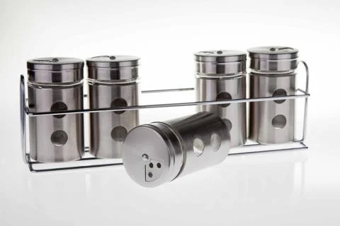 Spice rack for 5 metallic jars Stock Photos