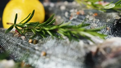 Spiced fresh raw fish with lemon juice and rosemary, dolly shot. 스톡 동영상 125580218
