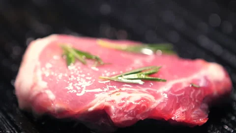 Spiced meat is grilled on a wire rack Stock Footage 139137054
