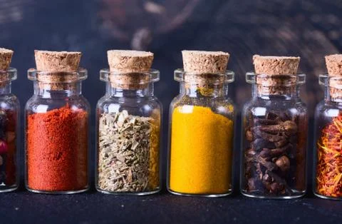 Spices in bottles Stock Photos