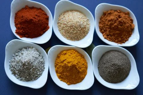 Spices close-up on blue background. Stock Photos