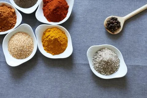 Spices close-up on a gray background. Stock Photos