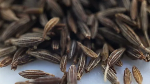 Spices cumin on a white background extremely close-up. Camera movement, real tim Stock Footage 129278144