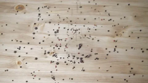 The spices fall on the wooden table. Pepper, paprika close-up. The concept of co Video stock 147310715