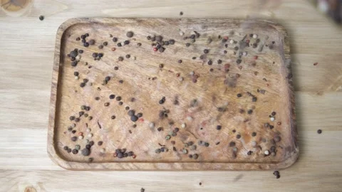 The spices fall on the wooden table. Pepper, paprika close-up. The concept of co Stock Footage 147310758
