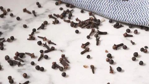 Spices falling on marble table Видео 115779587