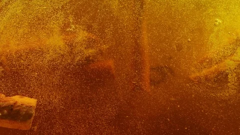 Spices Flying and Falling, in tea or mulled wine, underwater Slow Motion. Top Stock Footage 124716123